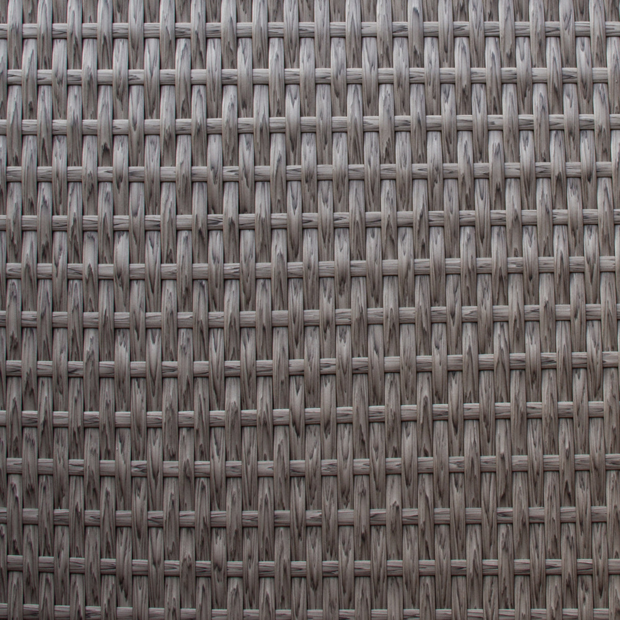 Tissu en rotin gris tissé, présentant une texture douce et résistante, idéal pour un salon de jardin moderne et élégant