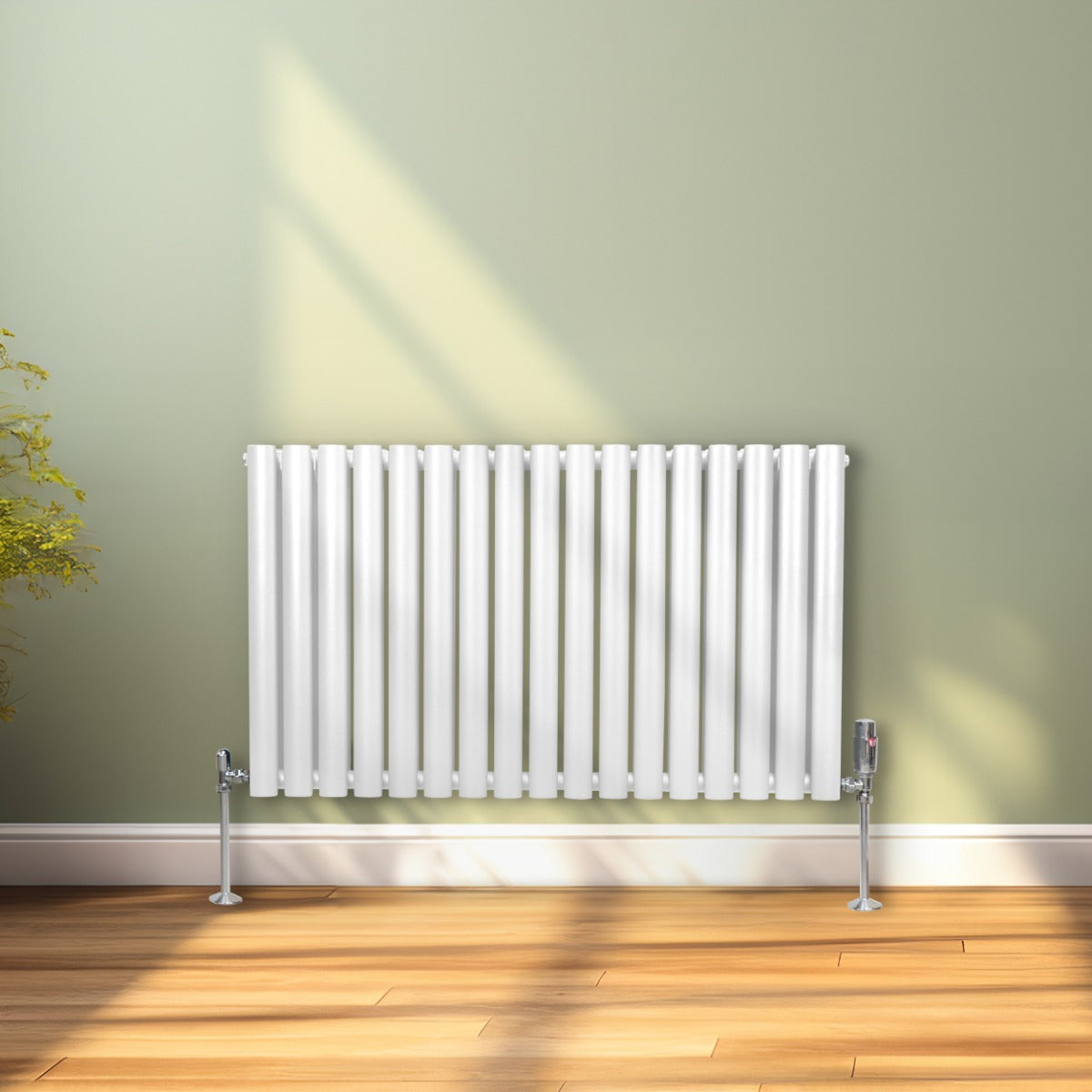 Radiateur à colonnes ovales blanc, 2 panneaux, 600 x 1020 mm, installé sur un mur vert, avec lumière naturelle et sol en bois clair