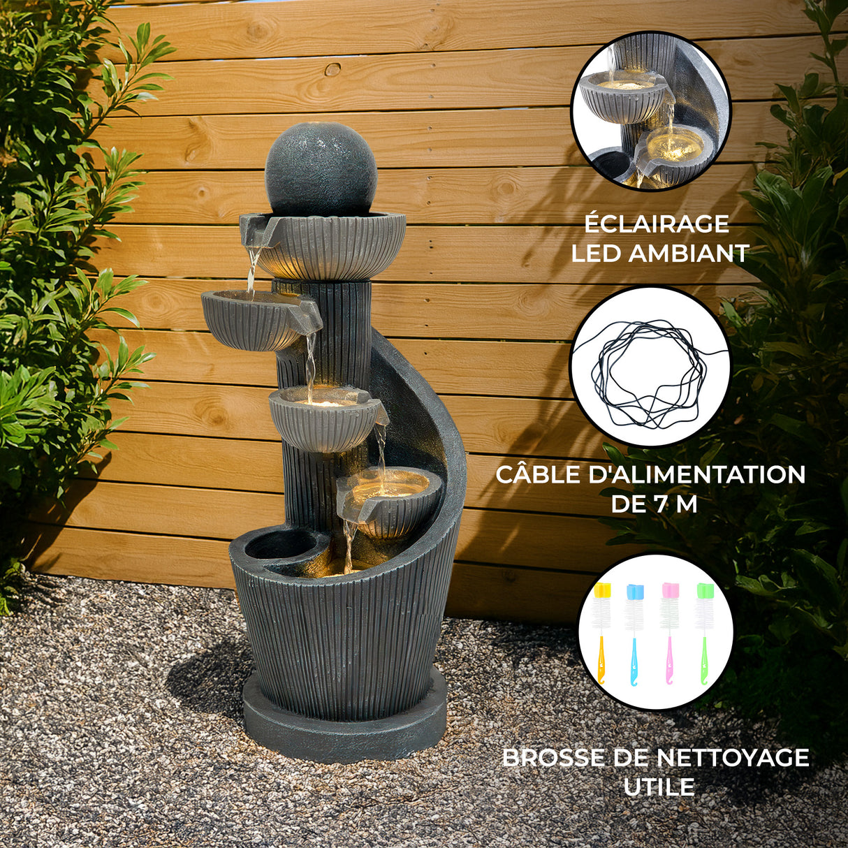 Fontaine de jardin en pierre grise avec quatre niveaux d'eau, éclairage LED, et câble d'alimentation de 7 m, entourée de verdure