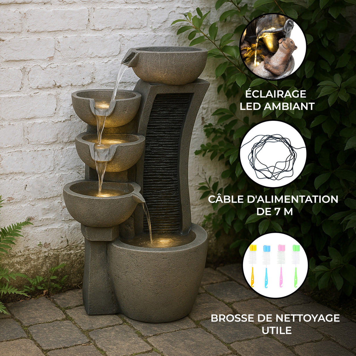 Fontaine de jardin moderne en béton gris avec quatre niveaux, éclairage LED, et eau s'écoulant doucement sur une surface texturée