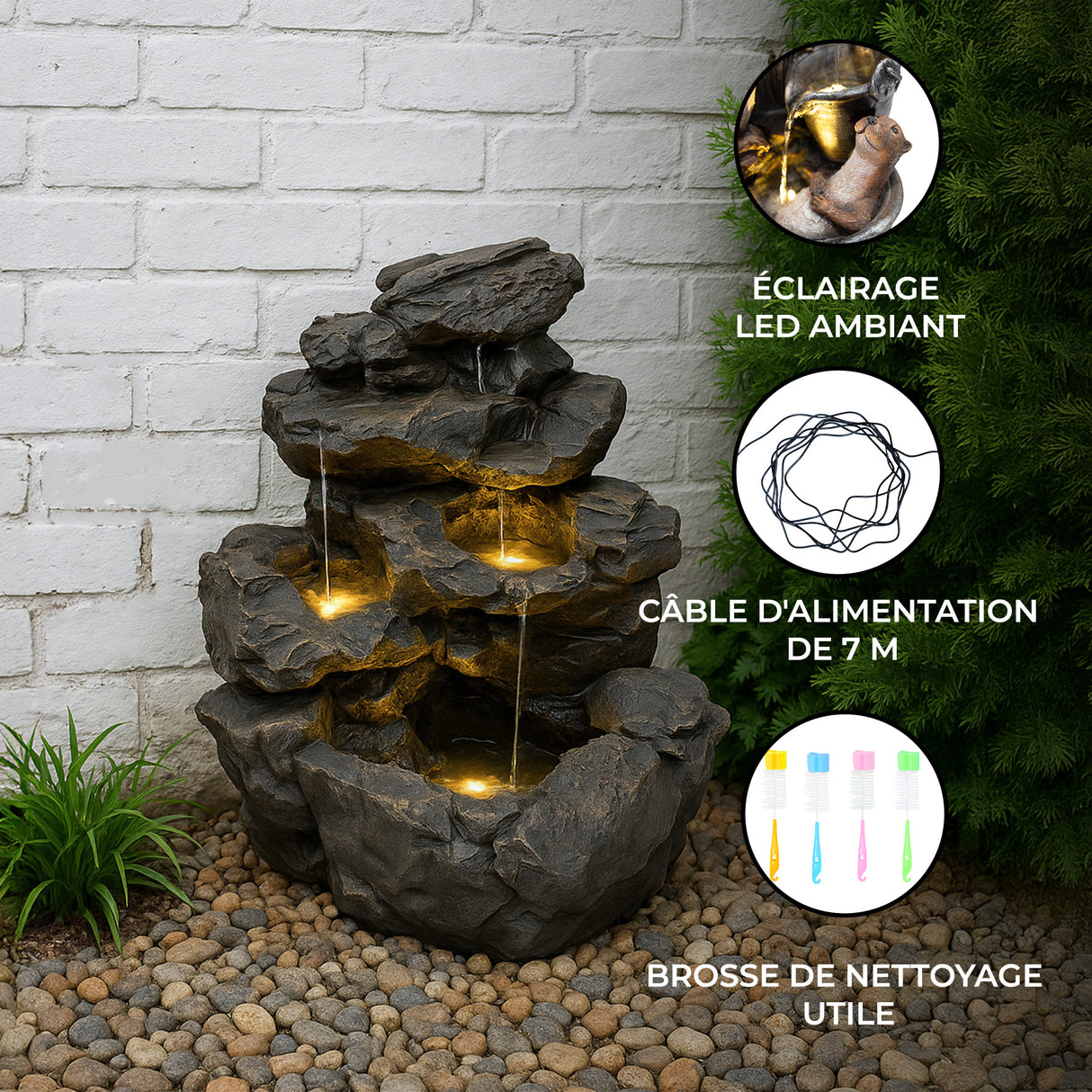 Fontaine de jardin en pierre artificielle avec trois niveaux, éclairage LED chaleureux, entourée de galets et de verdure