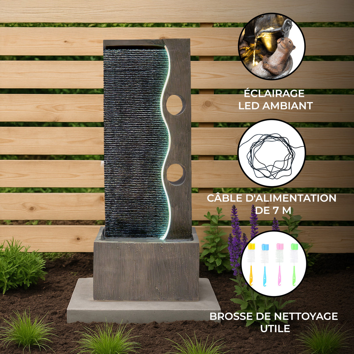 Fontaine de jardin moderne en béton avec éclairage LED, eau s'écoulant sur une surface texturée, entourée de fleurs violettes
