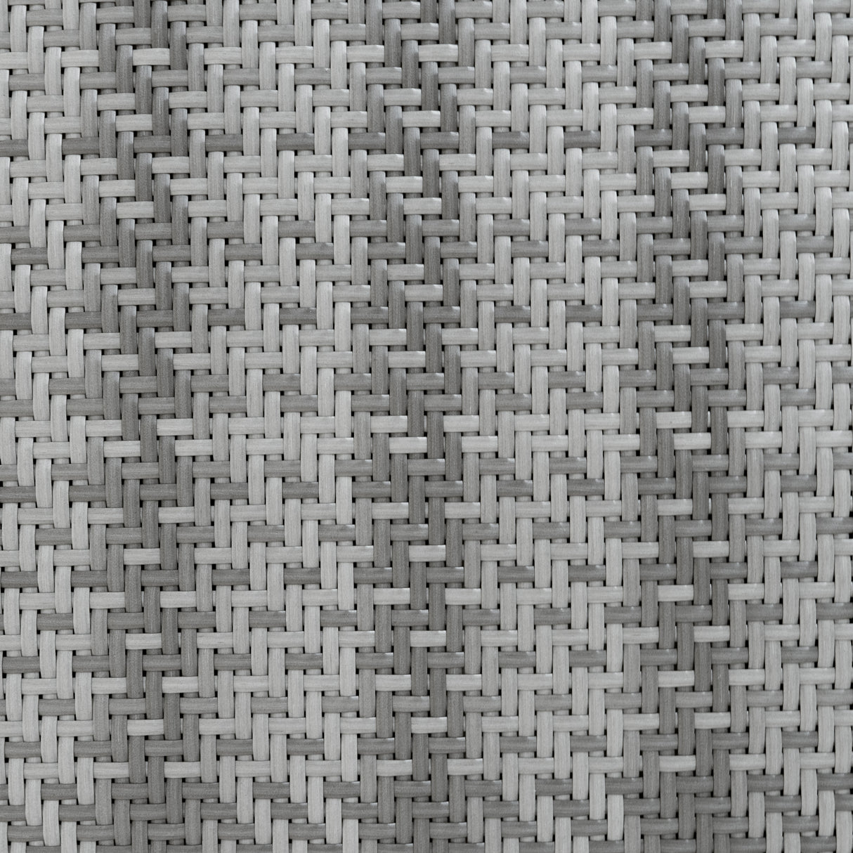 Tissage en rotin gris, présentant une texture complexe et élégante, idéale pour un salon de jardin modulaire de 7 pièces