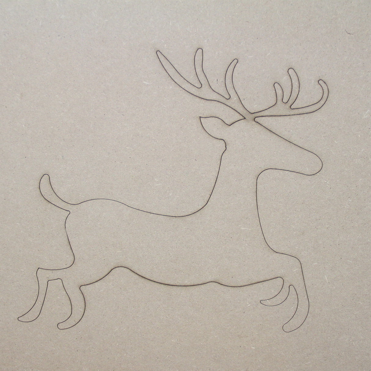 Traîneau du Père Noël en MDF naturel, silhouette de renne avec des bois délicats, texture lisse et couleur beige clair