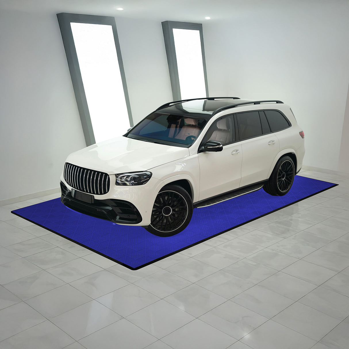 Carrelage de sol ventilé bleu pour garage, avec bordure, présentant une texture en relief et un design moderne, idéal pour véhicules