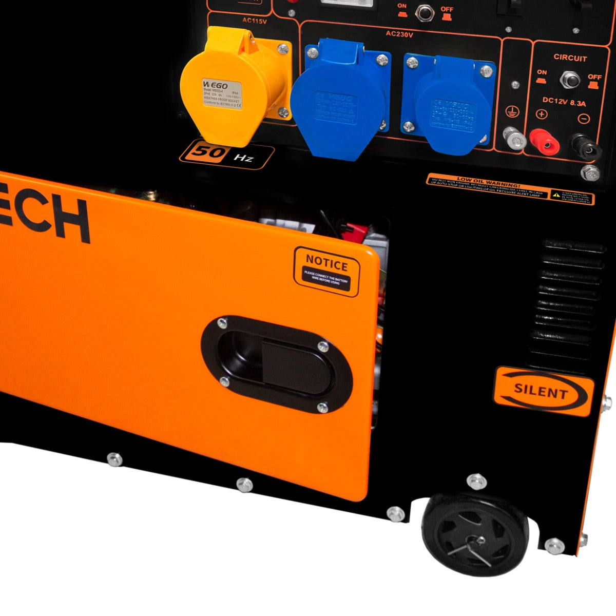 Générateur diesel T-Mech monophasé 230 V, 6 500 W, avec un boîtier noir et orange, prises bleues et jaunes, roulettes pour transport facile