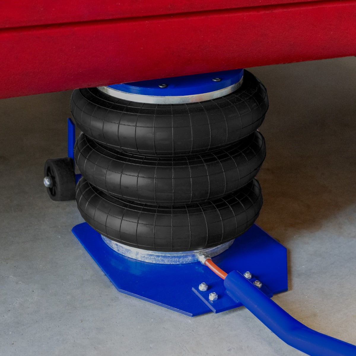 Cric pneumatique à manche long de 3,5 T avec trois sacs noirs en caoutchouc, base bleue robuste et tuyau orange pour gonflage