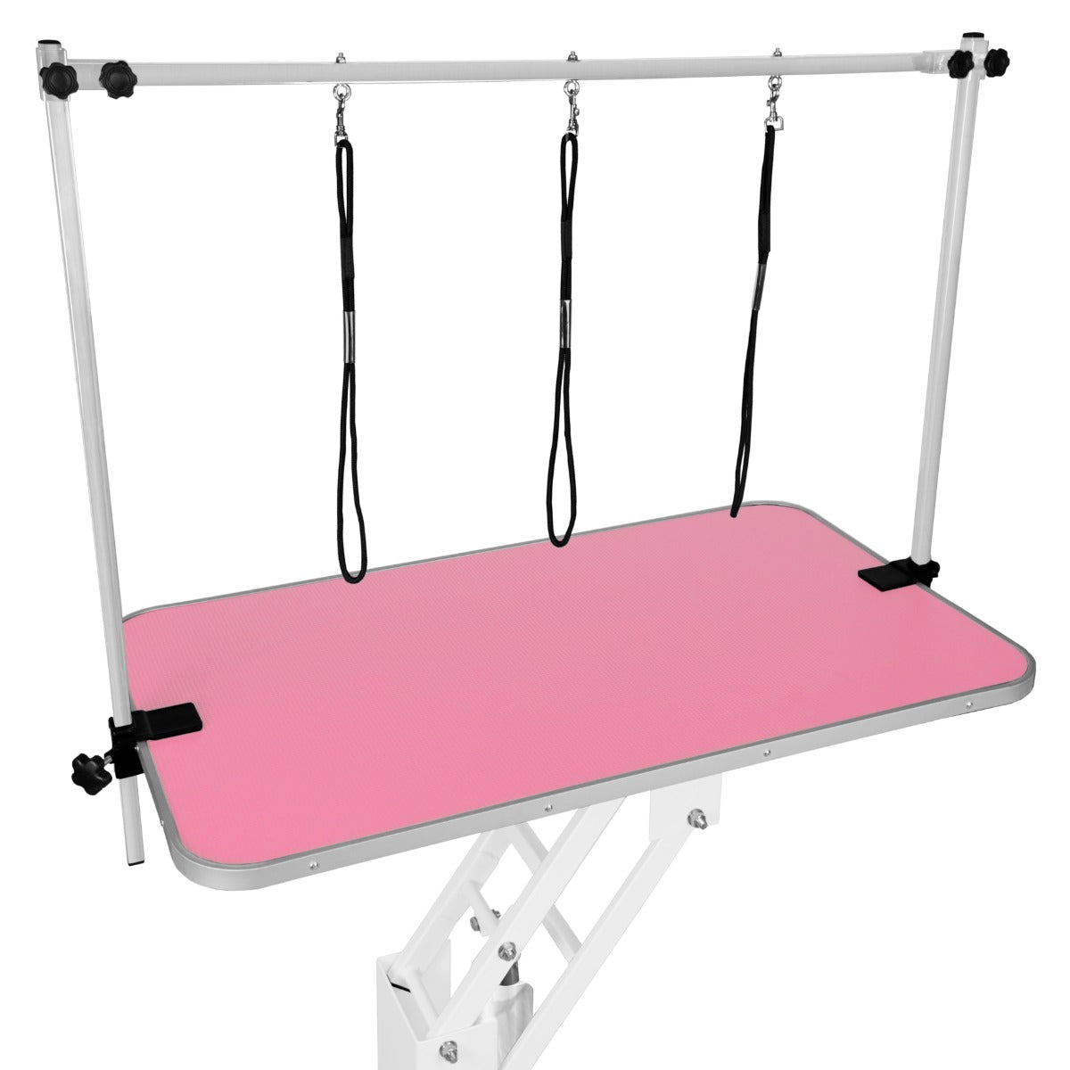 Table de toilettage hydraulique blanche avec plateau rose, surface texturée, supports réglables et sangles noires pour maintenir les animaux en place
