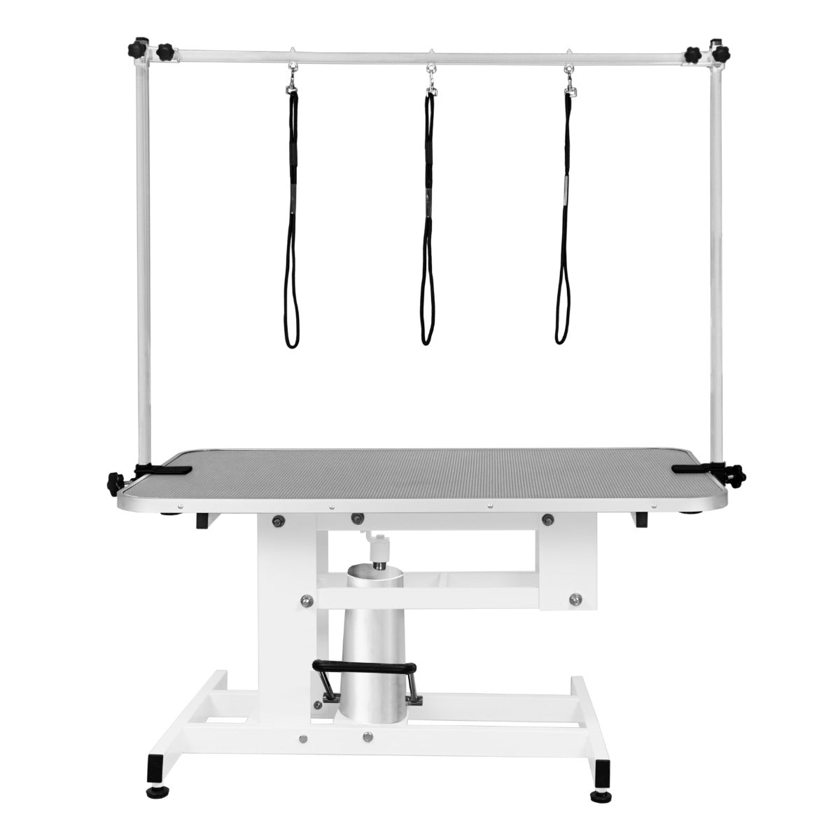 Table de toilettage hydraulique blanche avec plateau gris, équipée de trois sangles noires suspendues pour maintenir les animaux en place