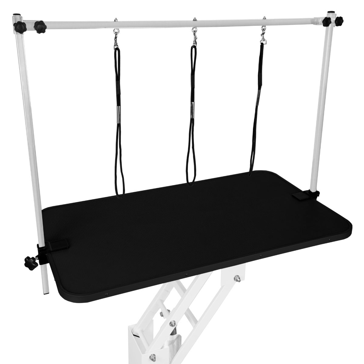 Table de toilettage hydraulique blanche avec plateau noir, surface antidérapante, barres de soutien ajustables et sangles noires