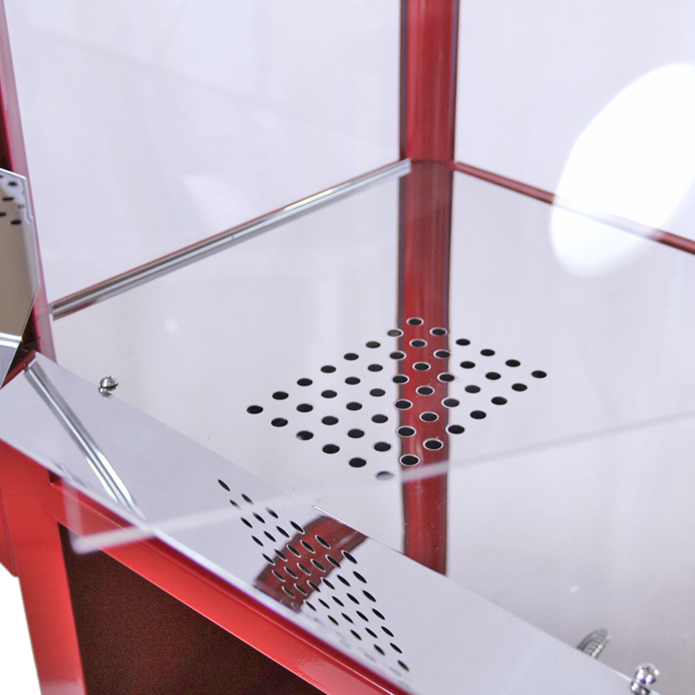 Machine à popcorn en inox rouge avec chariot, surface brillante et perforations pour ventilation, design vintage et élégant