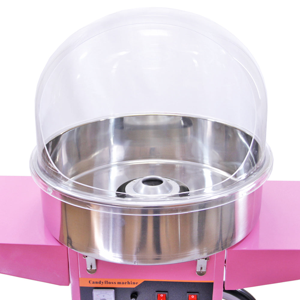 Machine à barbe à papa rose avec dôme transparent, cuve en acier inoxydable brillante, boutons de contrôle rouges en dessous