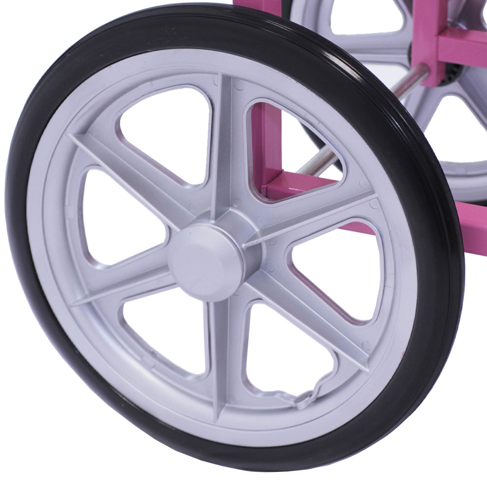 Roues en plastique gris avec un design à cinq branches, montées sur un chariot rose pour machine à barbe à papa, offrant une touche rétro