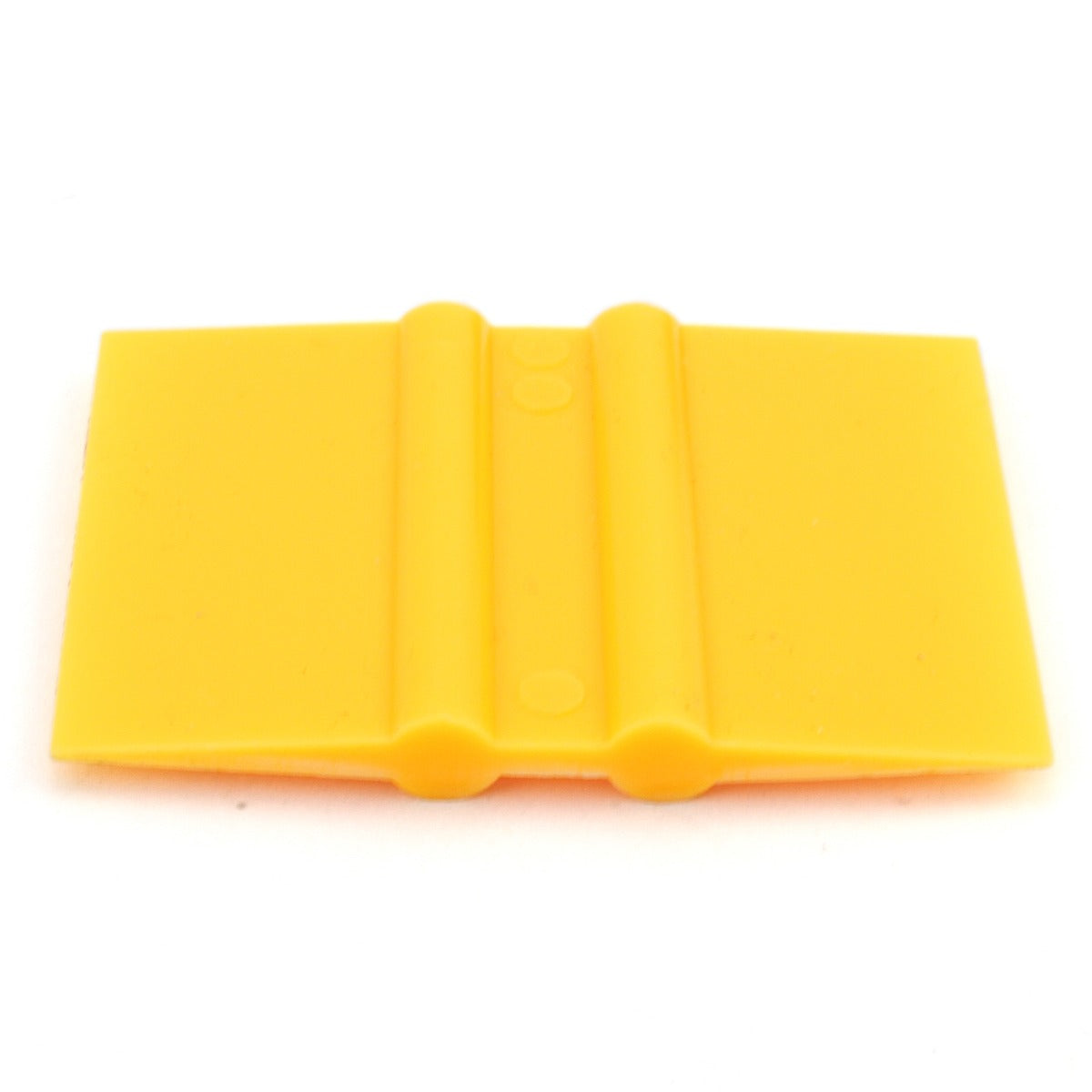 Outil de découpe en vinyle de couleur jaune, en plastique souple, avec une surface lisse et des bords arrondis pour un maniement facile