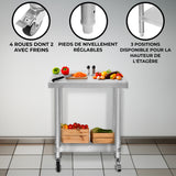 Plan de travail en inox 60 x 30 x 80 cm avec roulettes, pieds réglables et étagère, décoré de légumes frais et d'ustensiles de cuisine