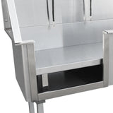 Baignoire de toilettage en inox, finition brillante, avec un espace de rangement en dessous et des attaches pour maintenir l'animal en place