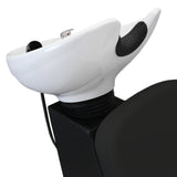 Fauteuil de salon de coiffure noir avec lavabo blanc, design moderne, texture lisse et courbes élégantes pour un confort optimal