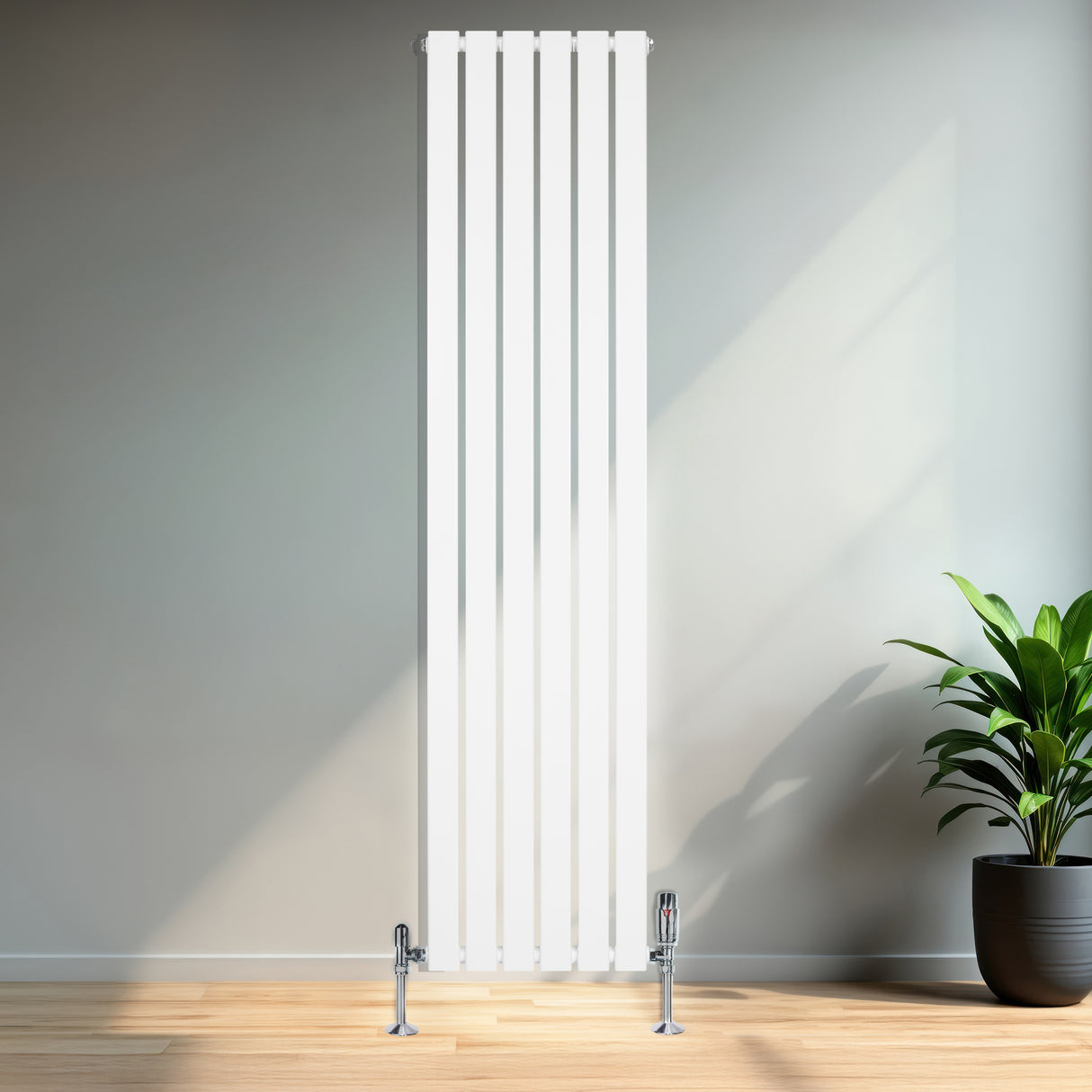 Radiateur plat blanc à 1 panneau, dimensions 1800 x 420 mm, avec vannes, installé dans un intérieur moderne avec plante verte