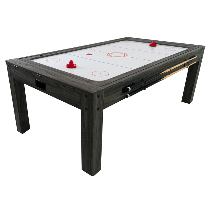 Table de hockey sur air en bois foncé avec surface blanche, deux pucks rouges et deux queues de billard sur le côté