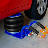 Cric pneumatique 3,5 T avec trois sacs en caoutchouc noir, tuyaux bleus et orange, sur une surface en béton sous une voiture rouge
